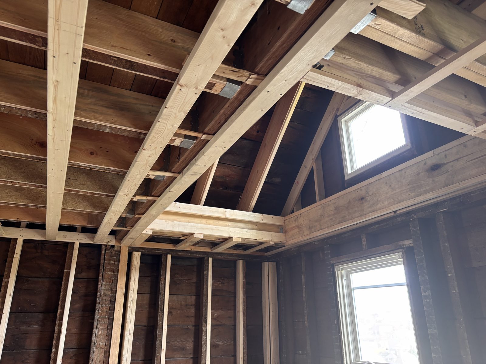New LVL beam with the ceiling opened up to expose the attic window